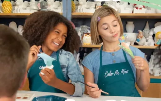 a few young girls in a classroom