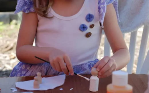 a girl cutting a cake