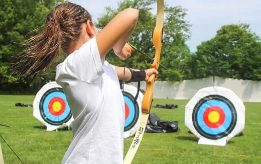 a person holding a bow and arrow