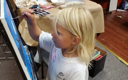 a young girl painting