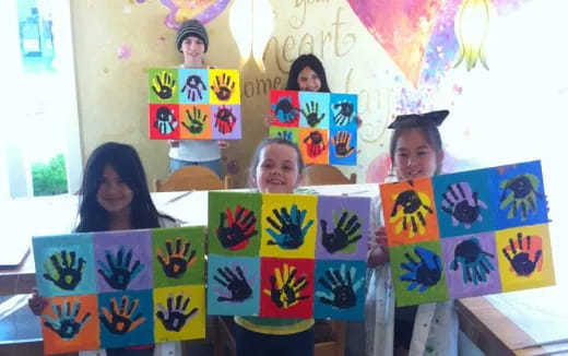 a group of children holding posters