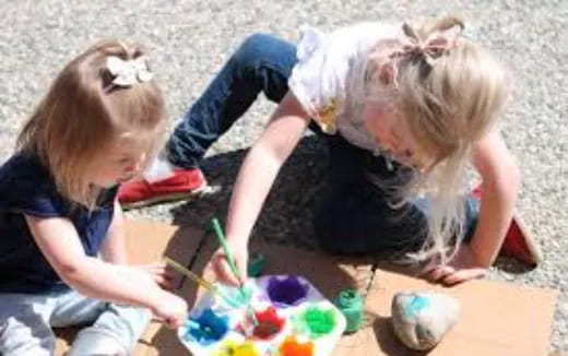 a couple of girls playing with toys