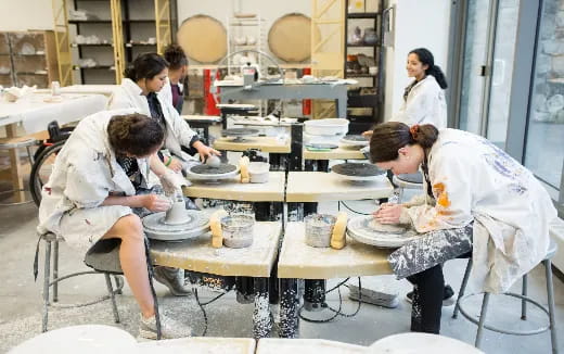 a group of people working in a kitchen