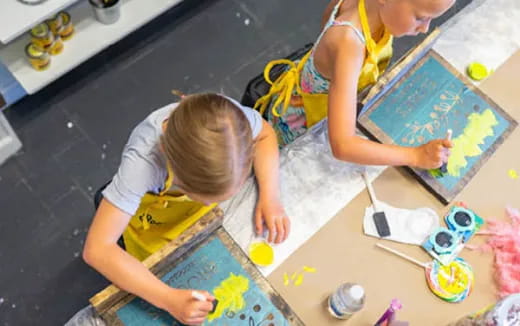 a child drawing on a paper