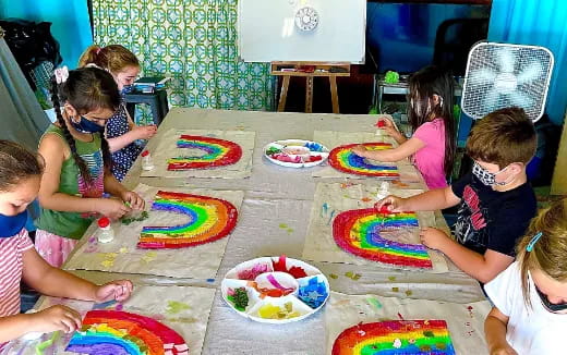 a group of kids are eating cake