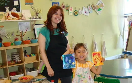 a person and a child posing for the camera