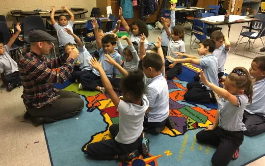 a group of children sitting on the floor