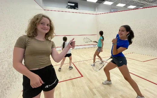 a group of women playing volleyball