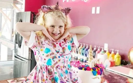 a girl holding a large basket of candy