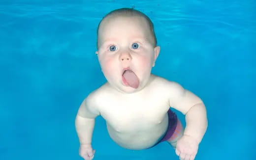 a baby in a pool