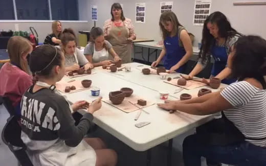 a group of people sitting around a table