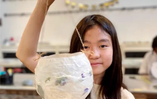 a woman holding a bag of food