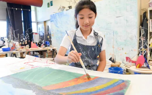 a young girl painting