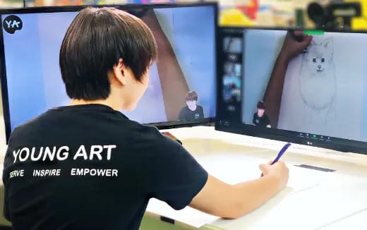 a person drawing on a white board