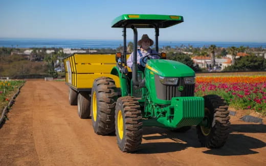 a person driving a tractor