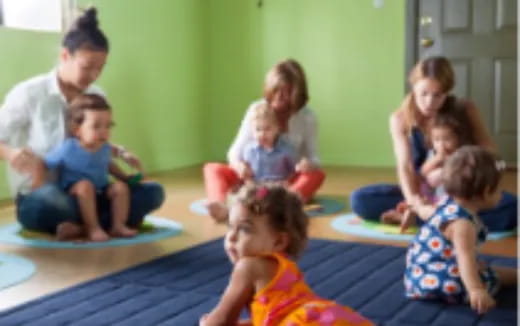 a group of children sitting on the floor