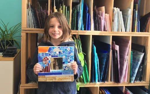 a girl holding a book