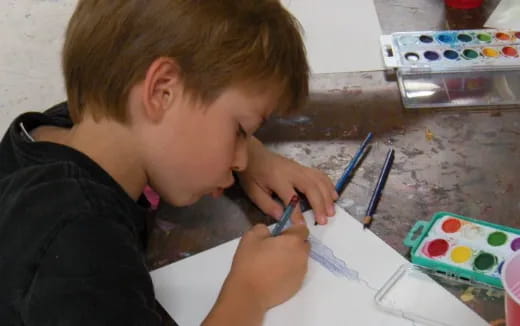 a young boy painting