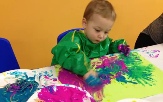 a child sitting at a table