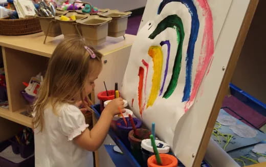 a young girl painting