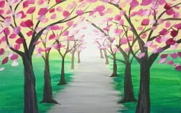 a row of trees with pink flowers
