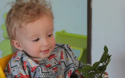 a child sitting in a chair