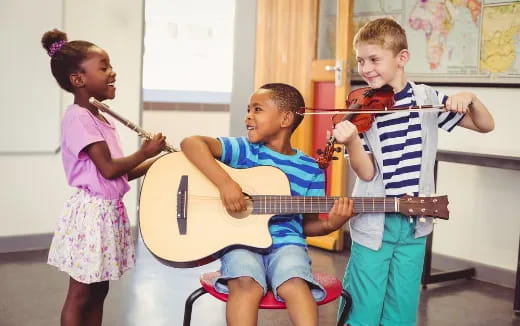a group of children playing instruments