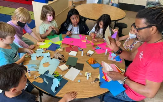 a group of people sitting around a table