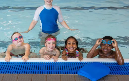 a group of kids in a pool