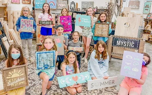 a group of children holding signs