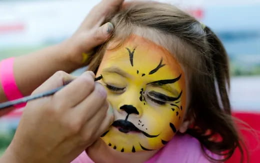 a girl with a face painted on her face