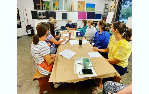 a group of people sitting at a table