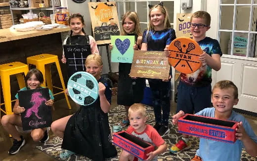 a group of children holding books