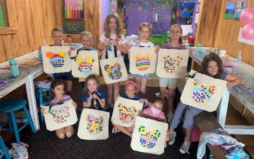 a group of children holding presents