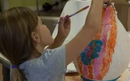 a young girl painting