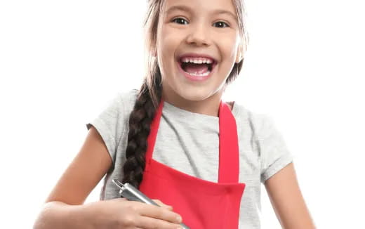 a young girl holding a phone