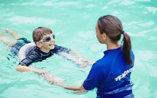 a person and a boy in the water