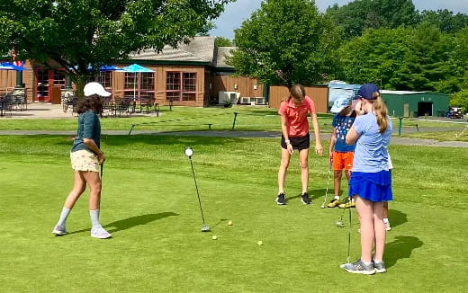 a group of people playing golf