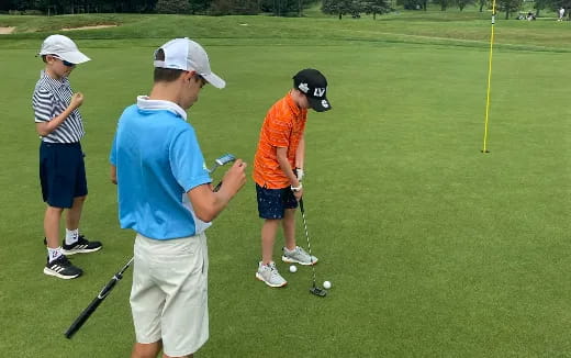 a group of people playing golf