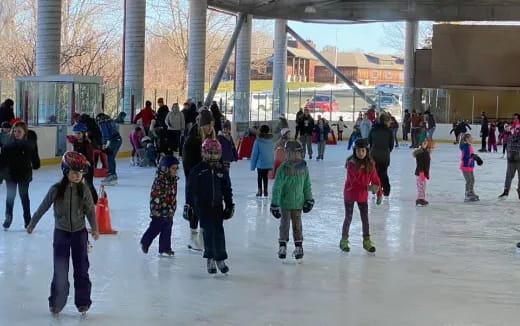 a group of people ice skating