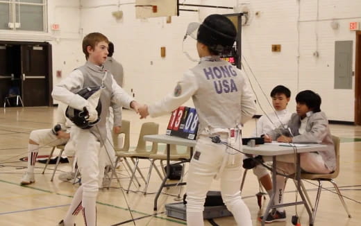 a group of kids in karate uniforms