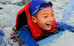 a boy in a pool