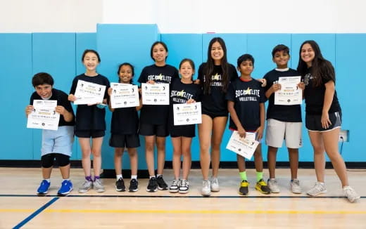 a group of kids holding signs