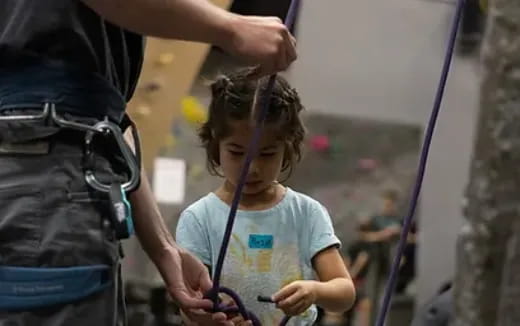 a young girl with a stethoscope around her neck