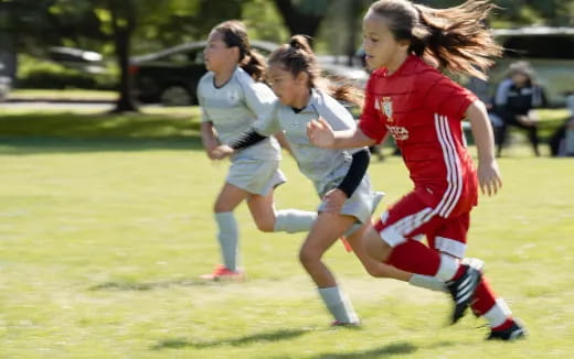 a group of girls playing football