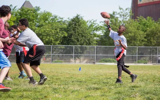 a group of people playing football