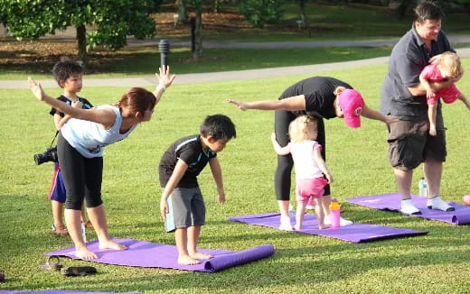 a group of kids doing yoga