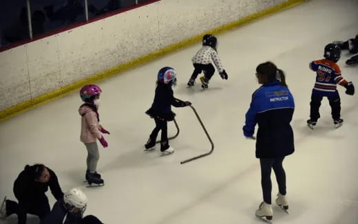 a group of people on an ice rink