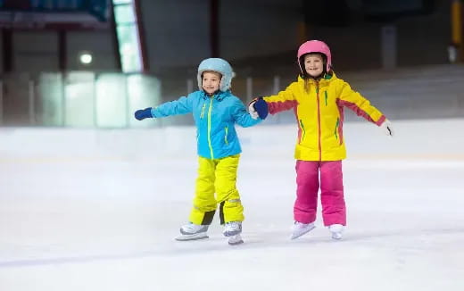 two children on ice skates