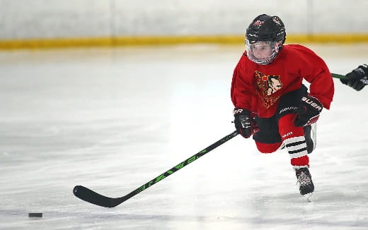 a man playing hockey